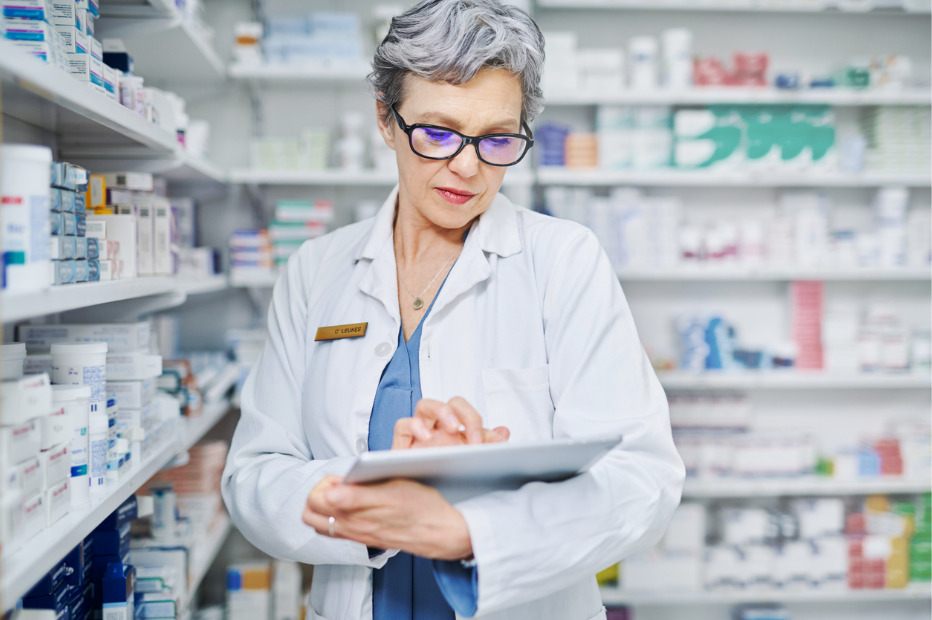 pharmacist working on a tablet device