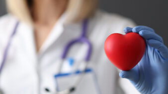 doctor holding red heart