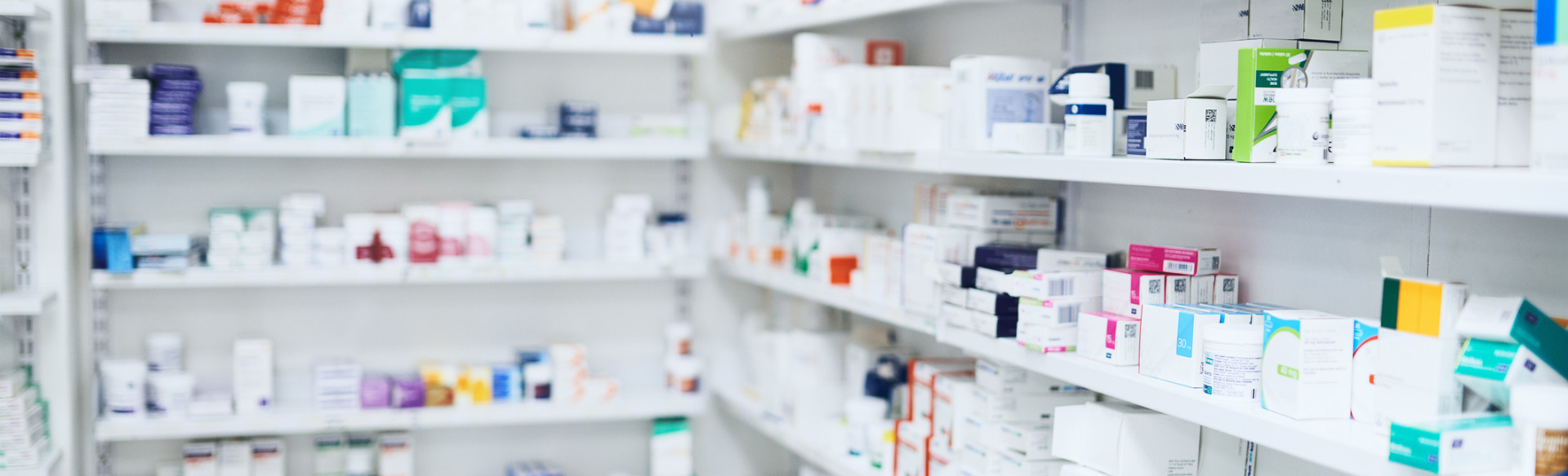 pharmacy shelves with various medications and prescriptions