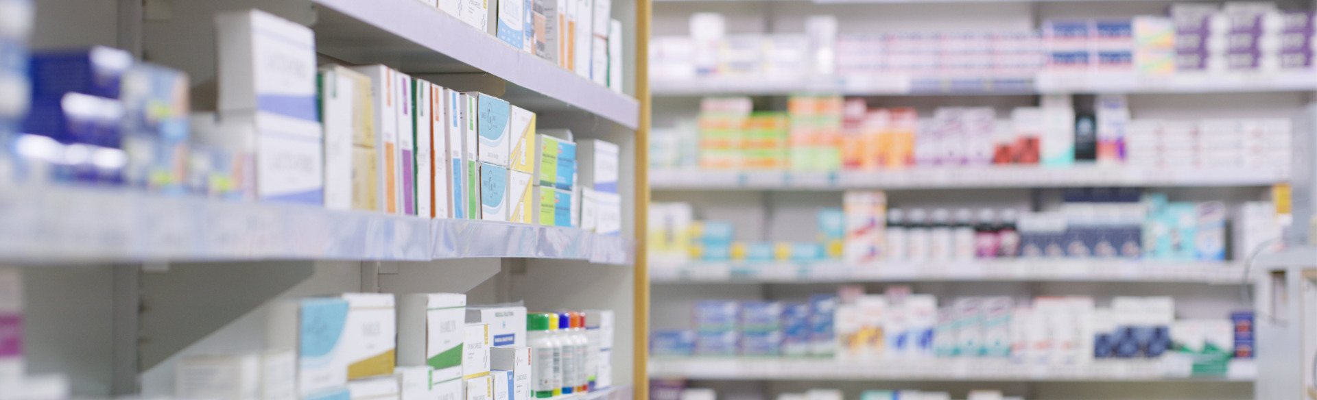 pharmacy shelves with various medications and prescriptions