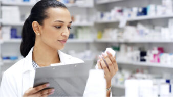pharmacist looking at medication label