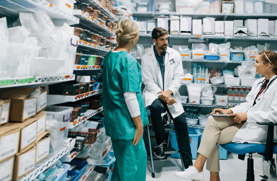 hospital Pharmacy with three staff members talking