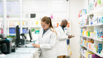 two pharmacists working in a community pharmacy