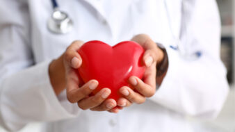 doctor holding a red heart