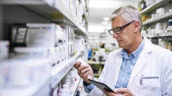 pharmacist looking at a medication