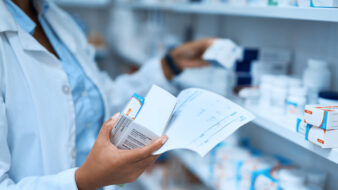 pharmacist looking at medication stock
