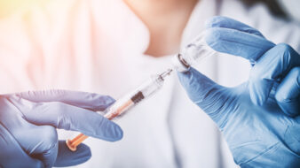 pharmacist holding vaccine