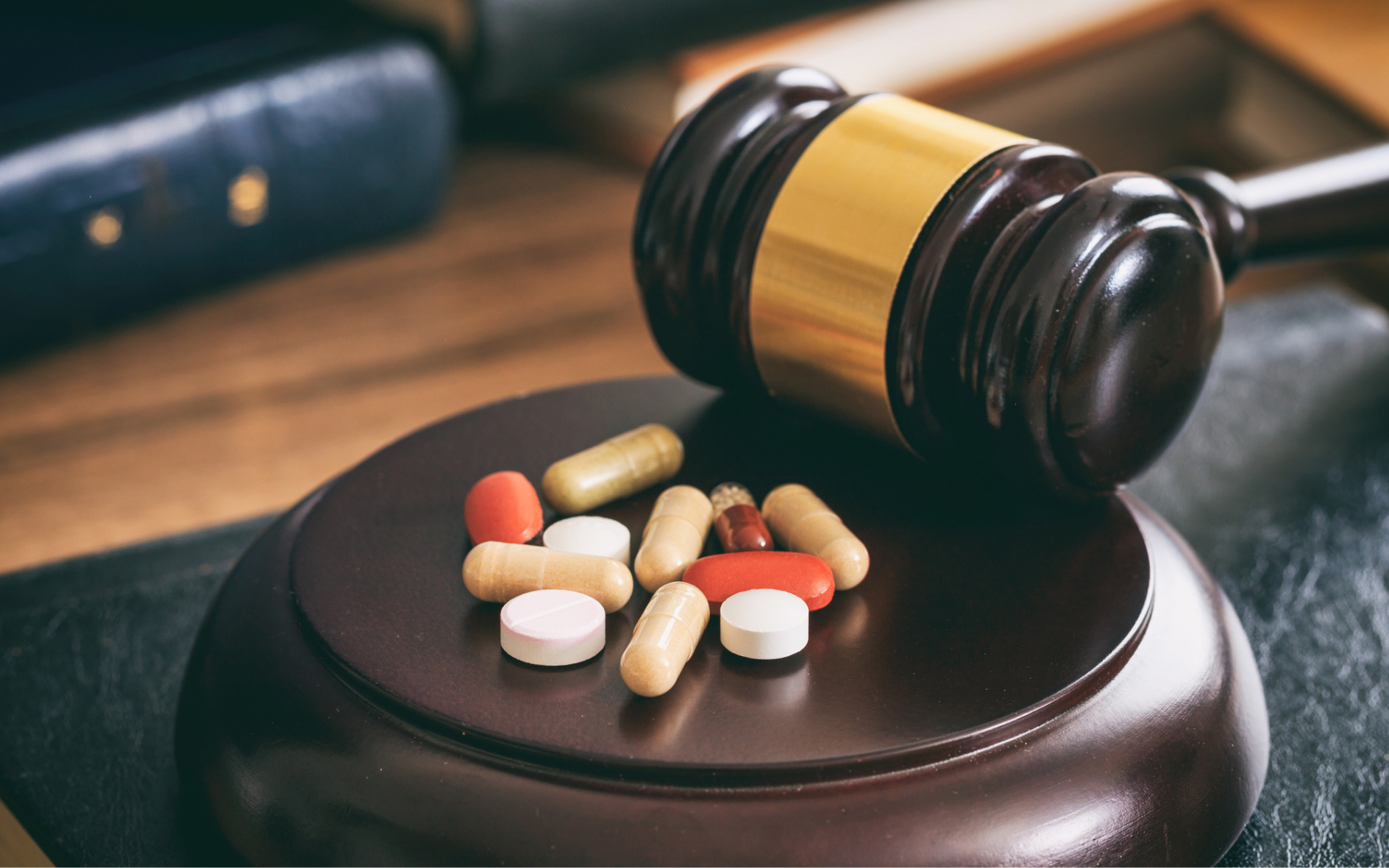 close up of a gavel and pills