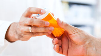 Pharmacist giving pills to customer