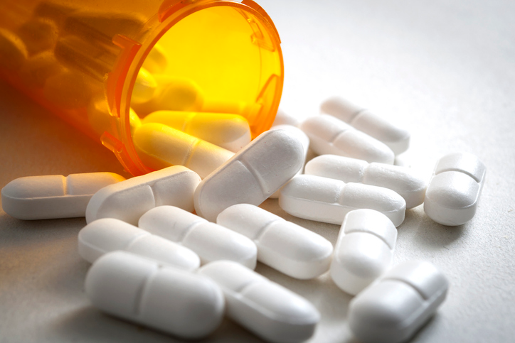 opioid medication spilling out the prescription bottle