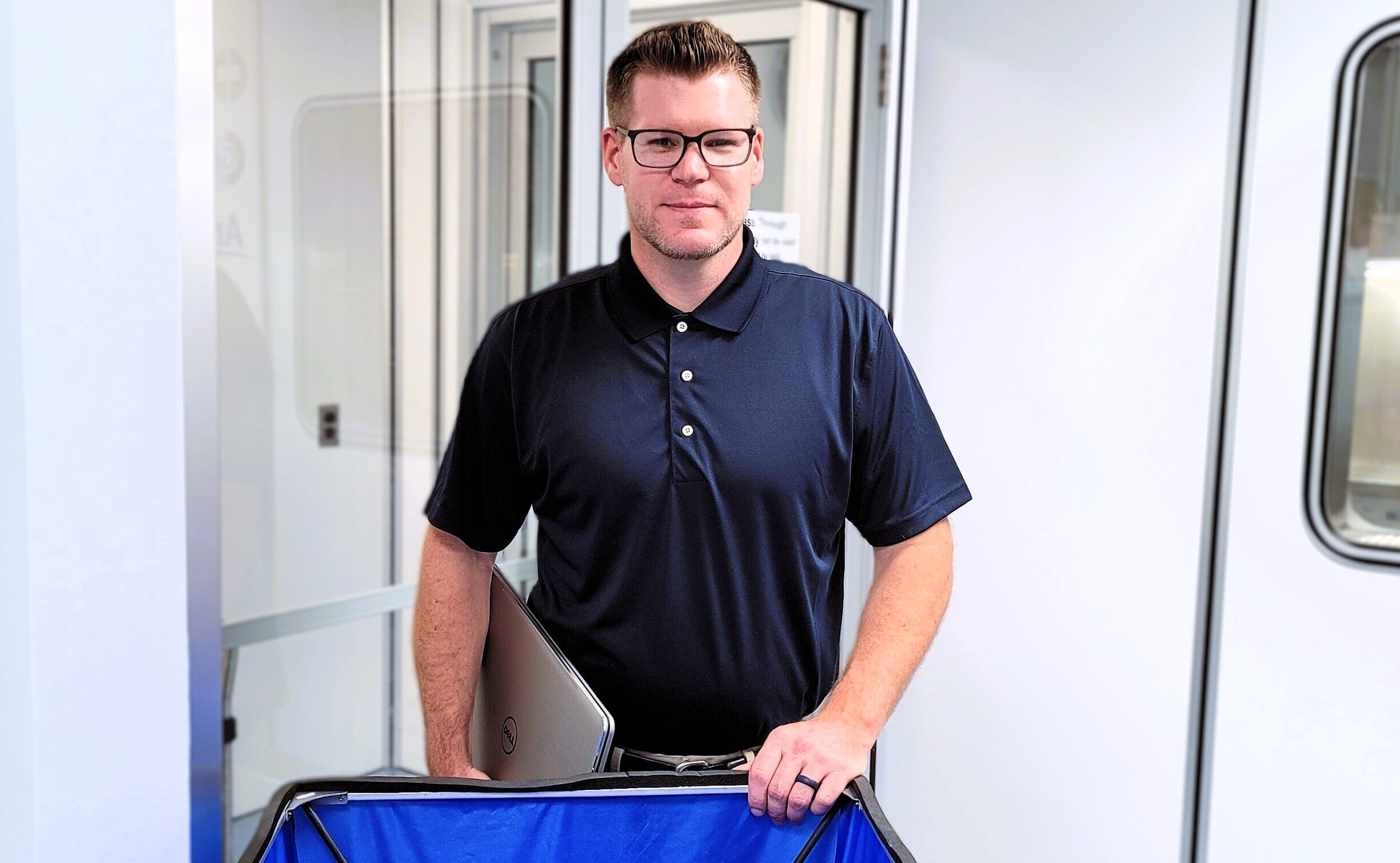 certifier standing outside of cleanroom