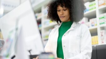pharmacist standing at the counter