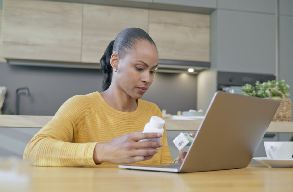 female searching for medications on computer