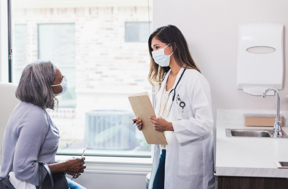 nurse practitioner speaking with a patient