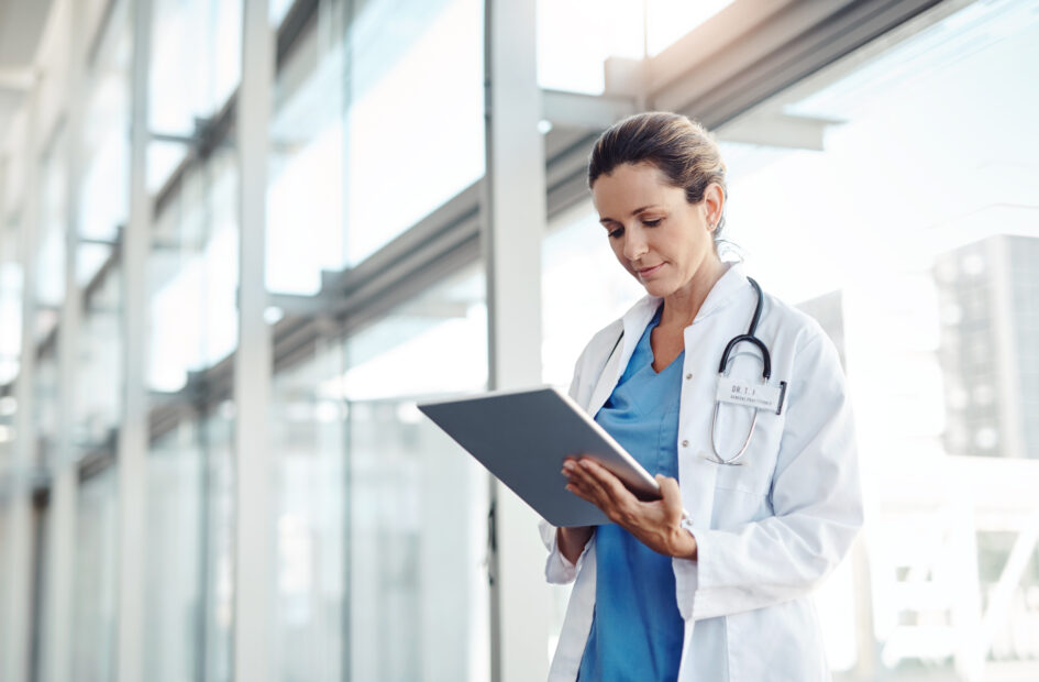 nurse practitioner working on a tablet device