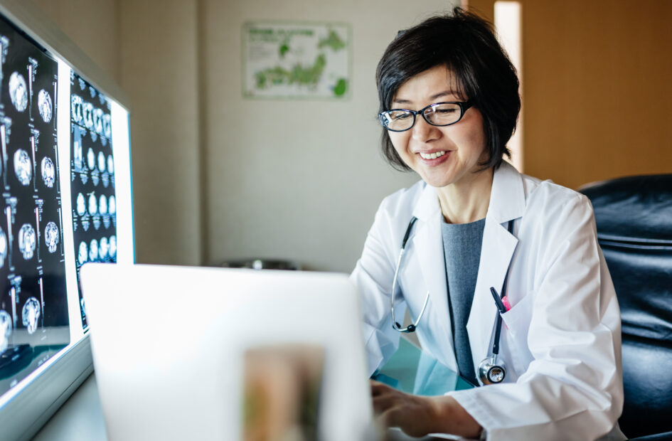 nurse practitioner working on a computer