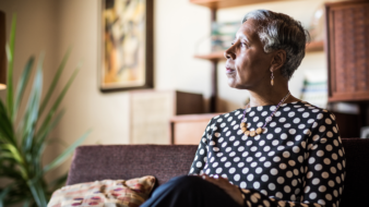 close up of woman sitting on a couch