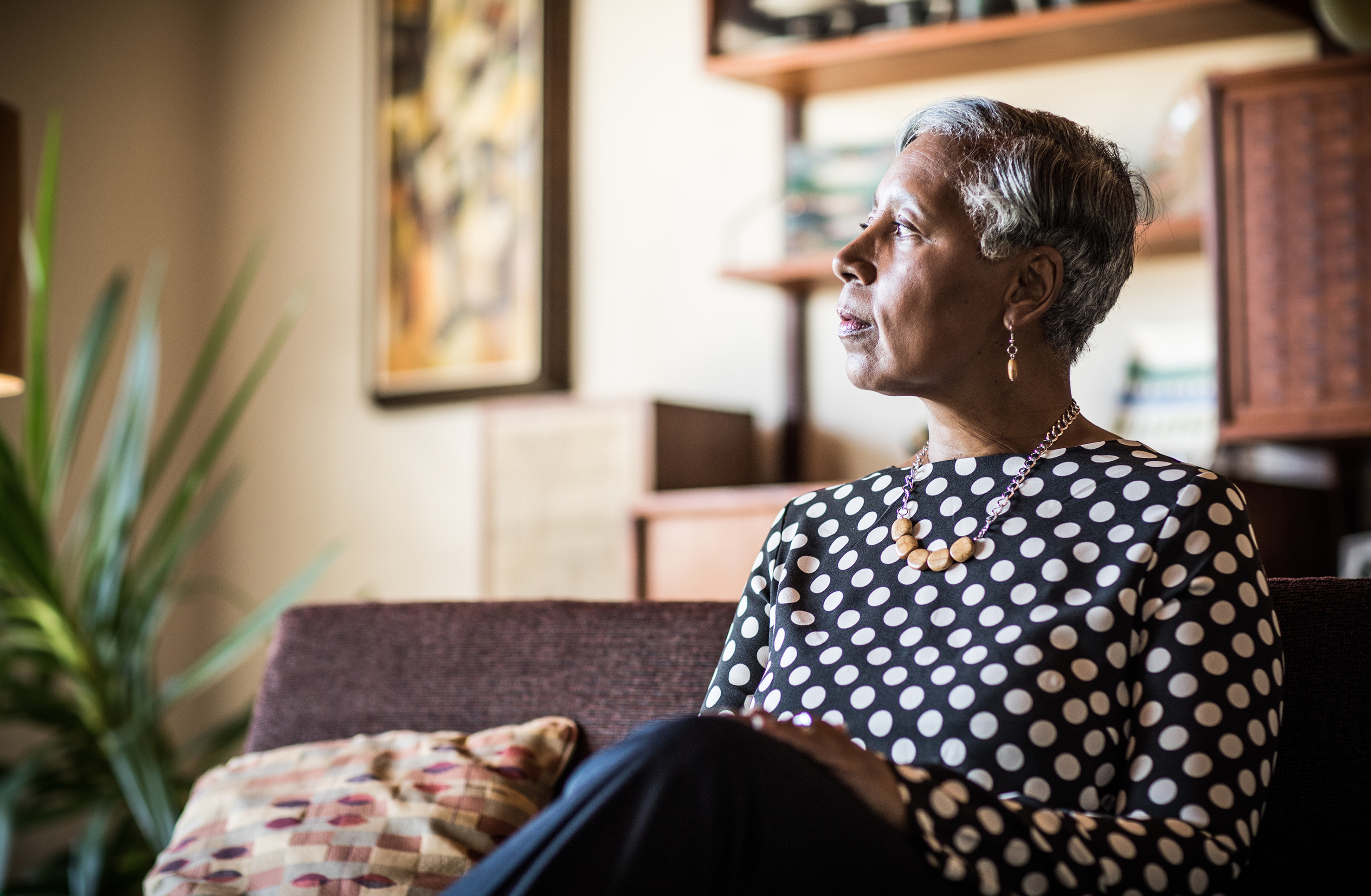 close up of woman sitting on a couch