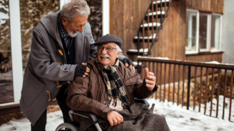 nurse helping a senior patient in a wheelchair