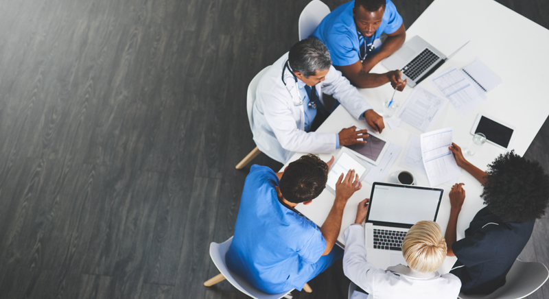 healthcare team sitting at a table together