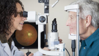 optometrist giving a patient an eye exam